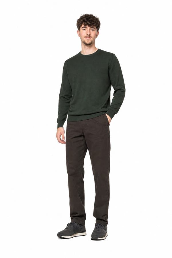 A forest green sweatshirt over chocolate chinos, for the clothes you actually reach for.