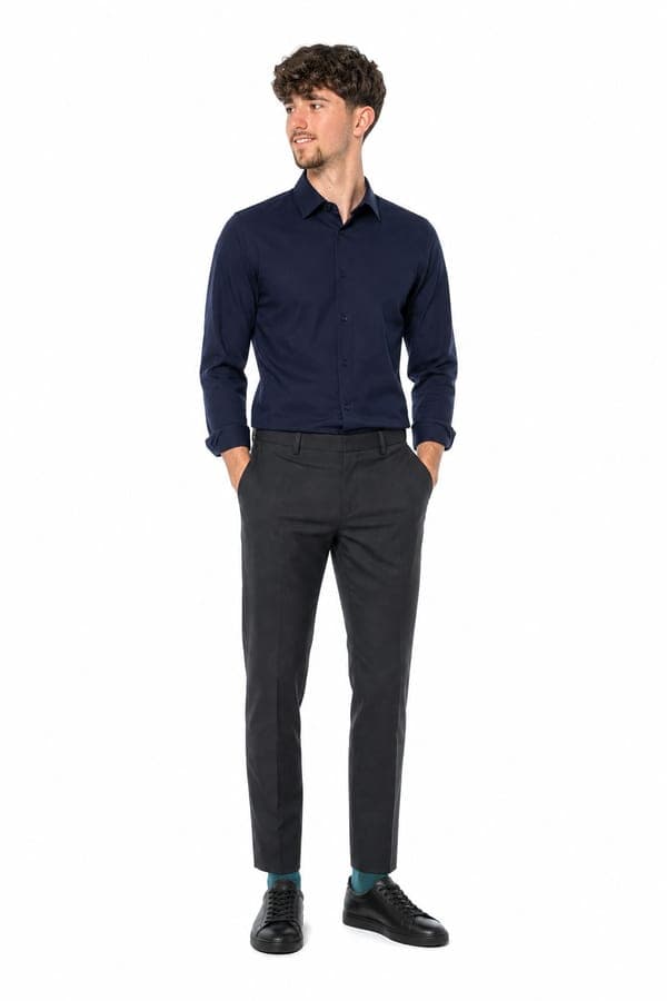 A midnight blue shirt with charcoal trousers, for a city day with no streetwear in sight.